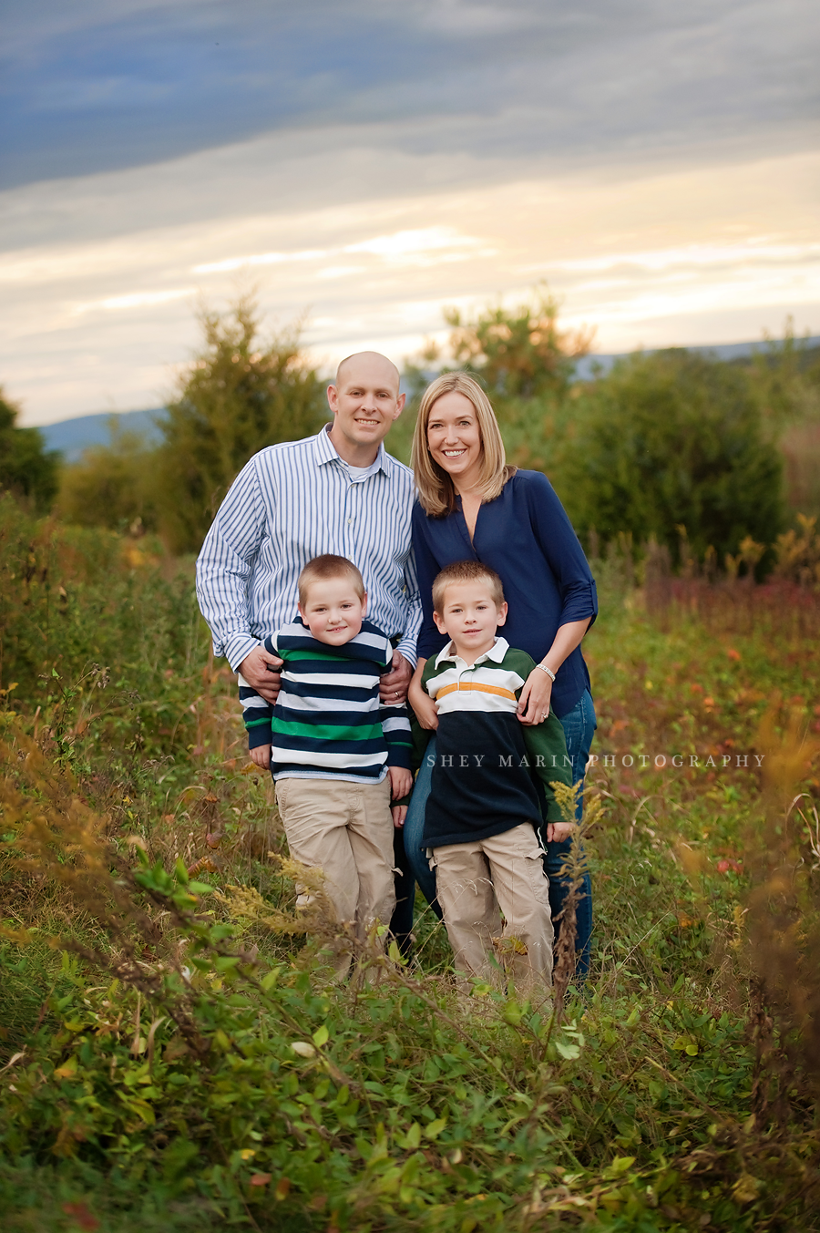 happy smiling family in fall foliage