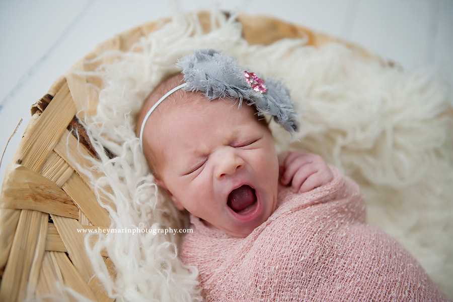 newborn baby girl yawning