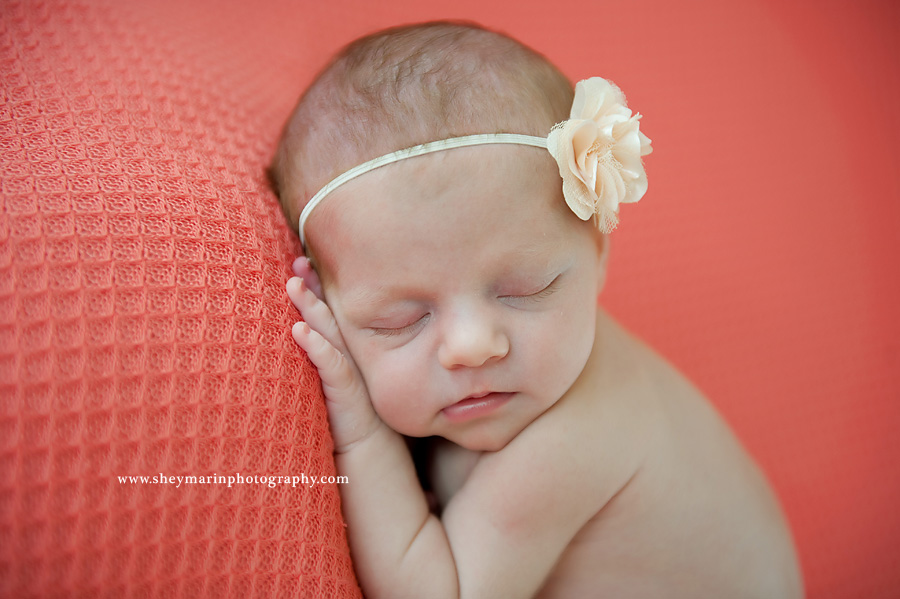 newborn girl with peach headband