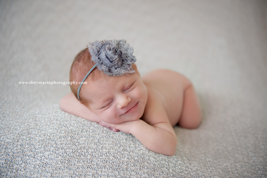 newborn baby girl in grey