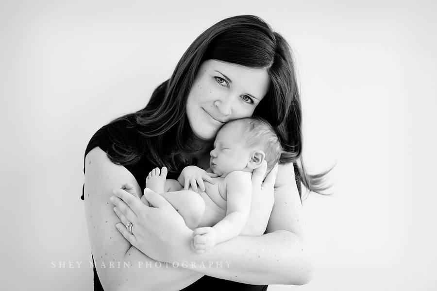 black and white photo of a mother holding her new son