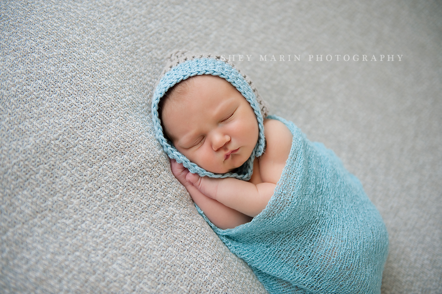 baby boy in a blue wrap