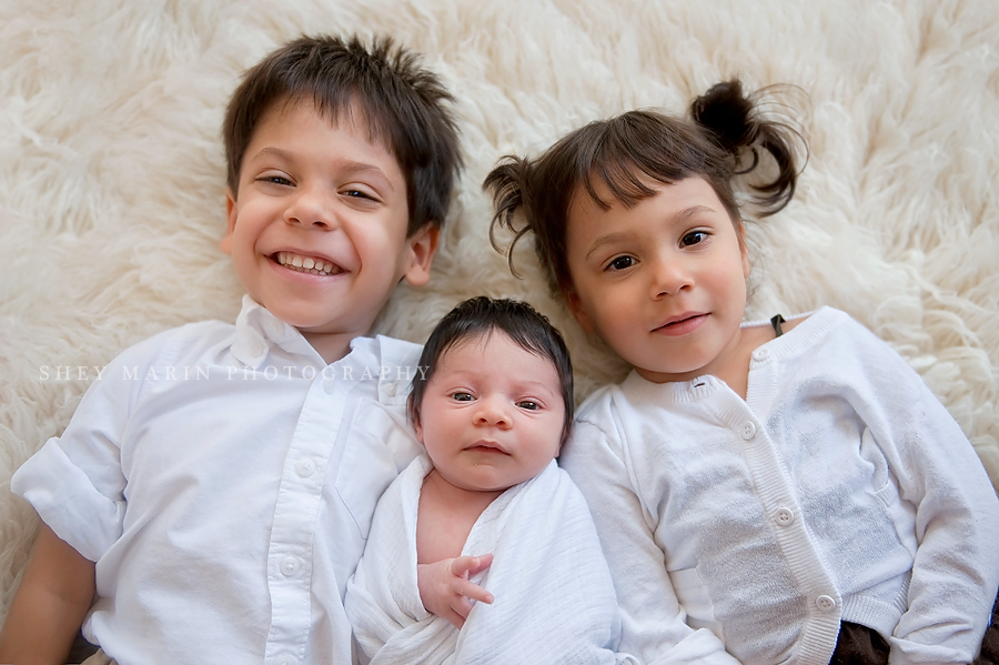 three siblings together smiling
