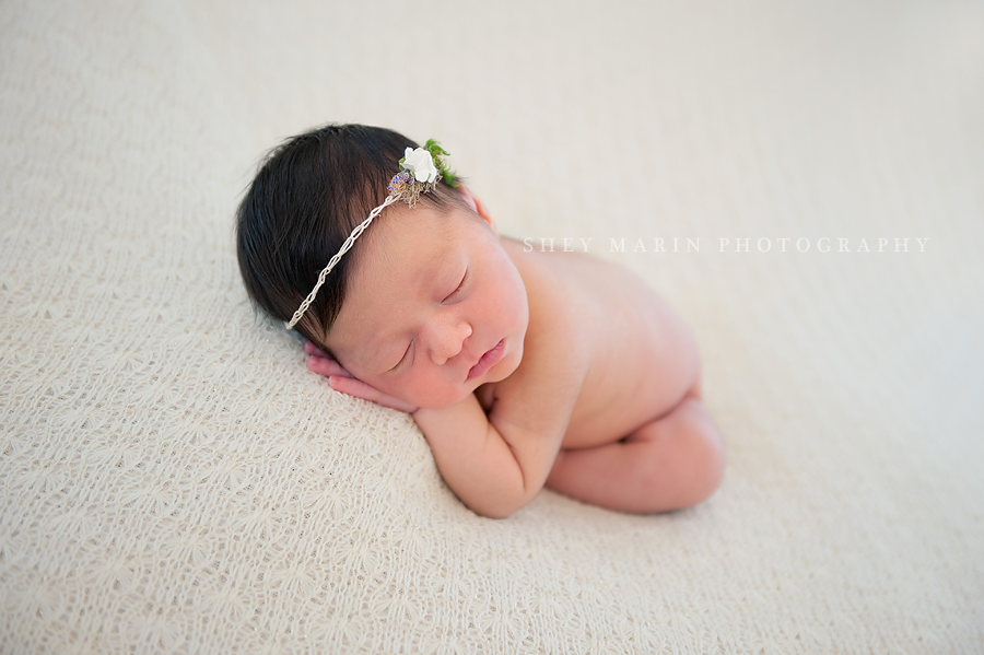 newborn baby girl with delicate headpiece