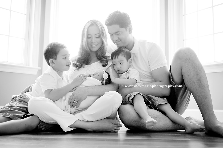 black and white family photo with newborn