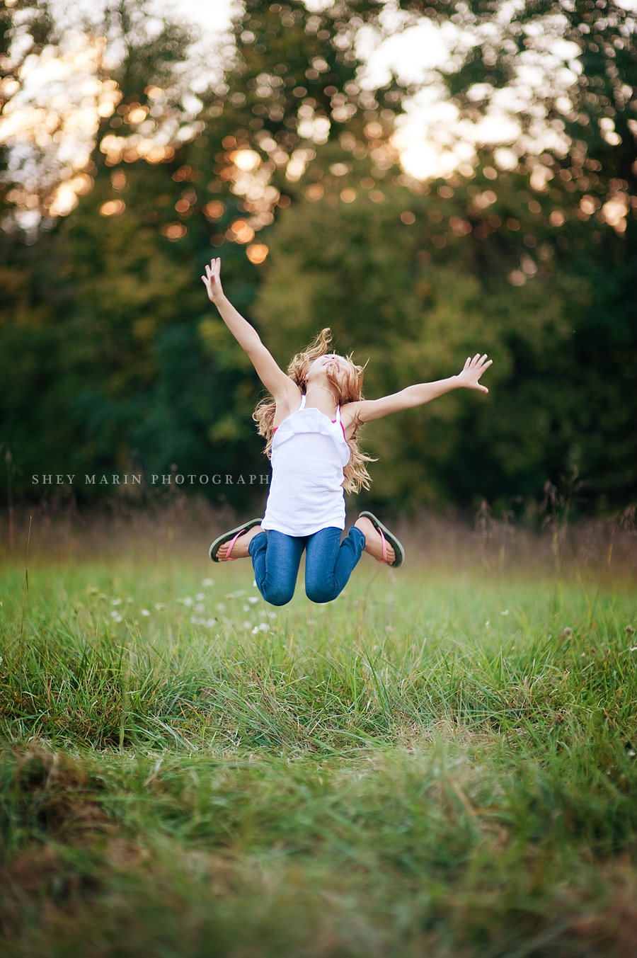 adorable girl jumping for joy