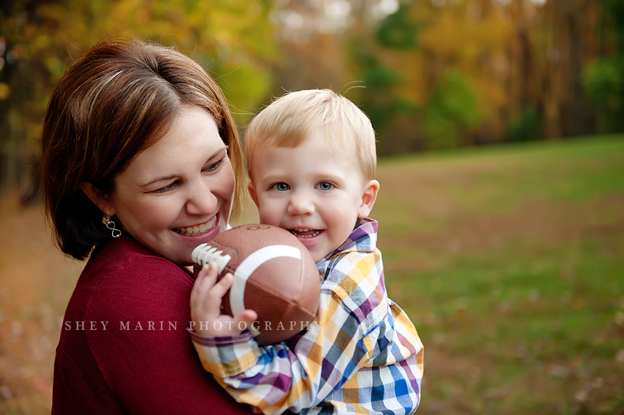 Little boy holding a football