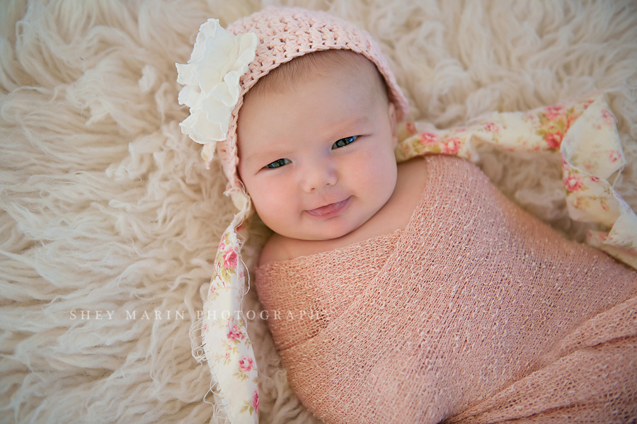 newborn baby girl smiling in frederick maryland