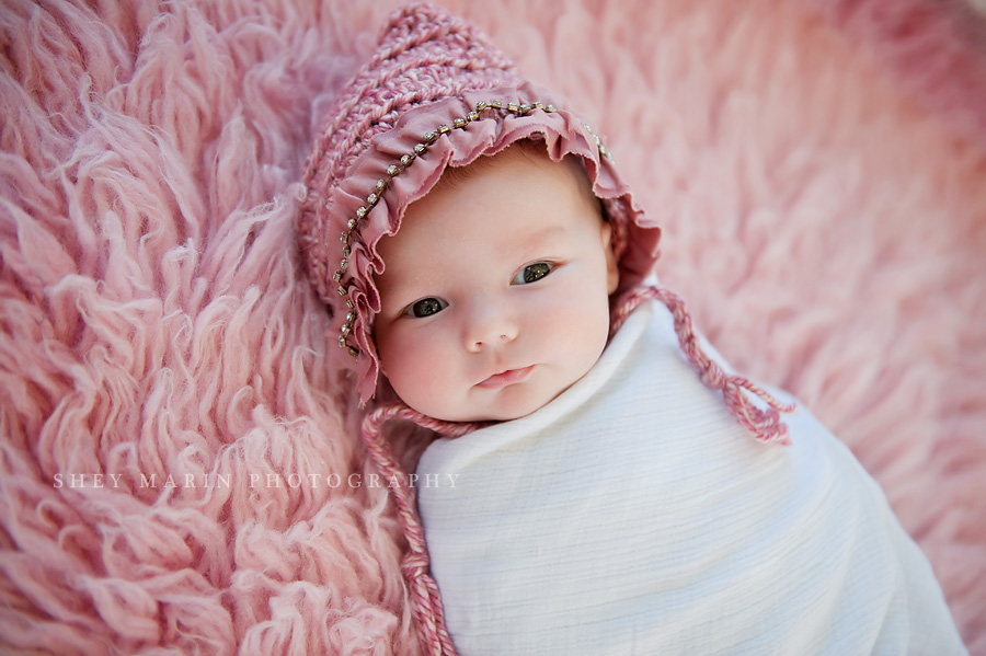 7 week old baby girl in pink hat