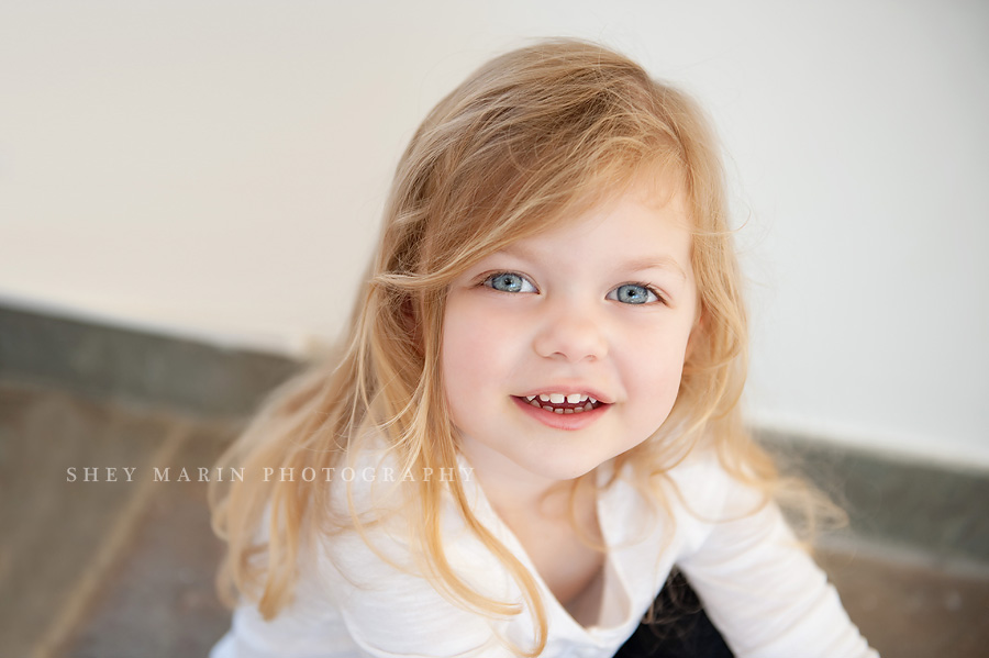 blue eyed little girl smiling