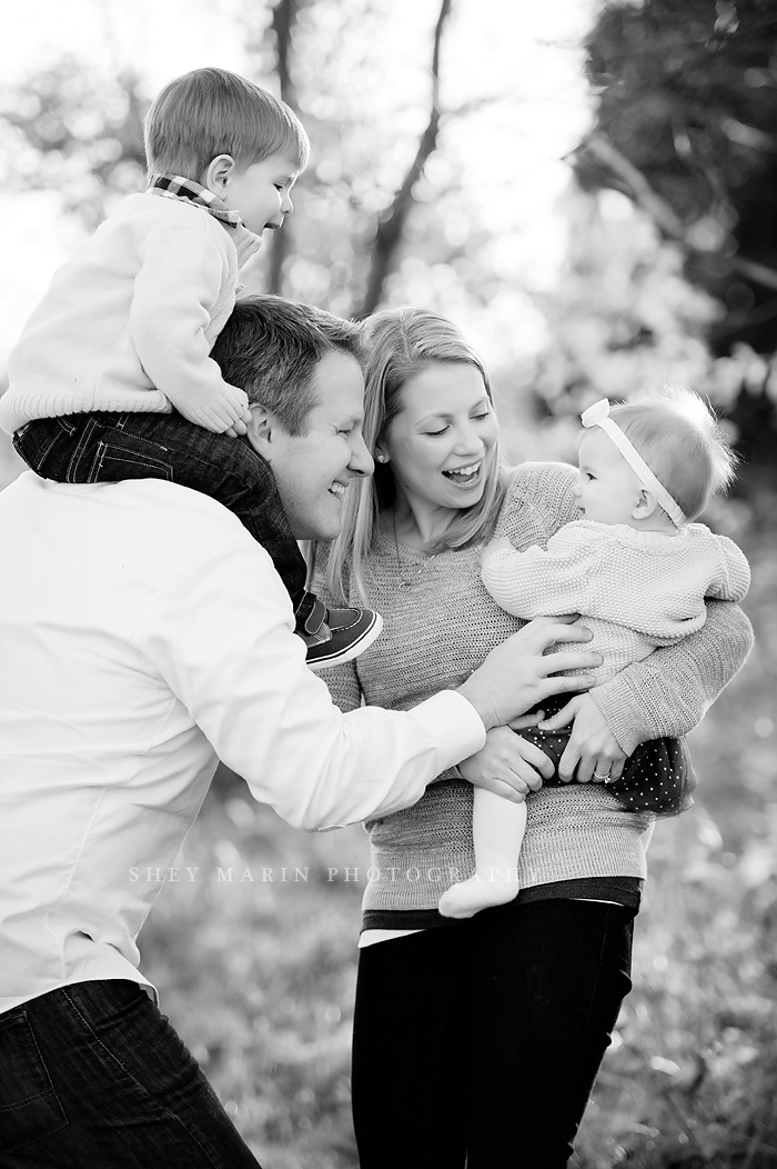 black and white photo of family laughing