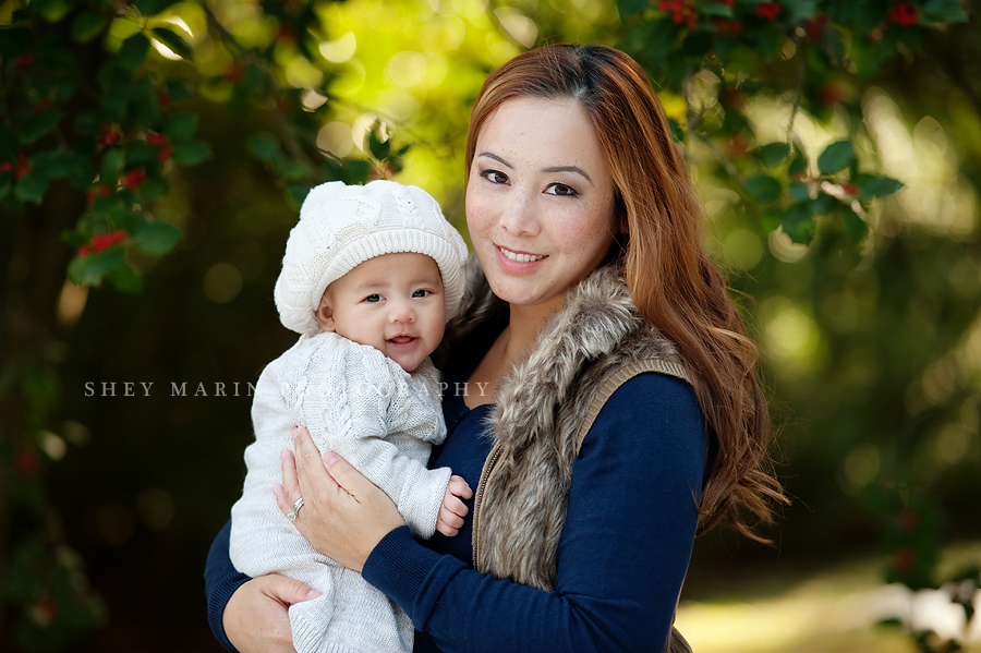 beautiful mother and daughter in winter with hats