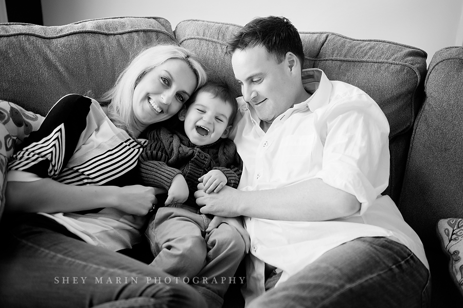 black and white photo of family hugging in Maryland home