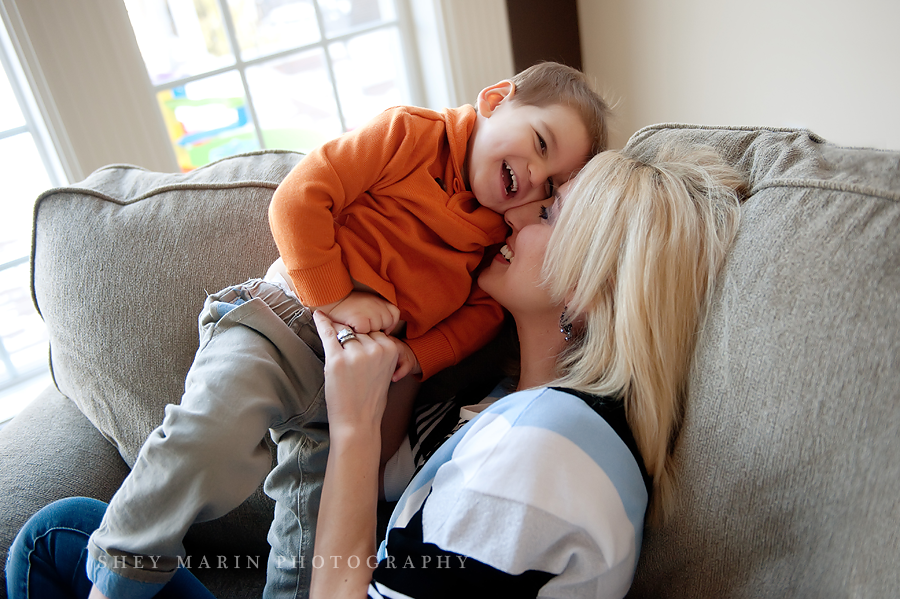 Mom and little boy snuggling in lifestyle photo session