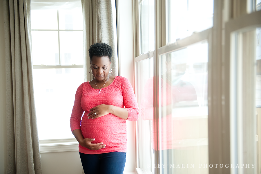 maternity photo of woman in window light