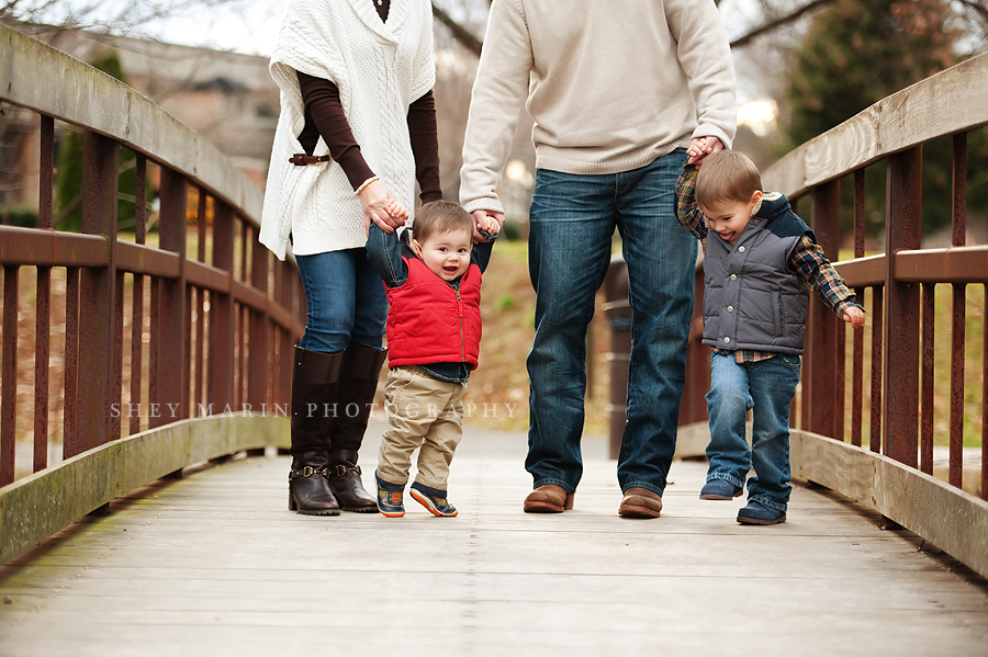 family on a footbridge in Frederick, MD