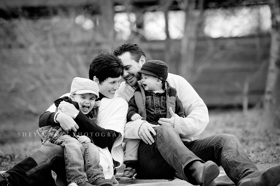black and white photo of family laughing 