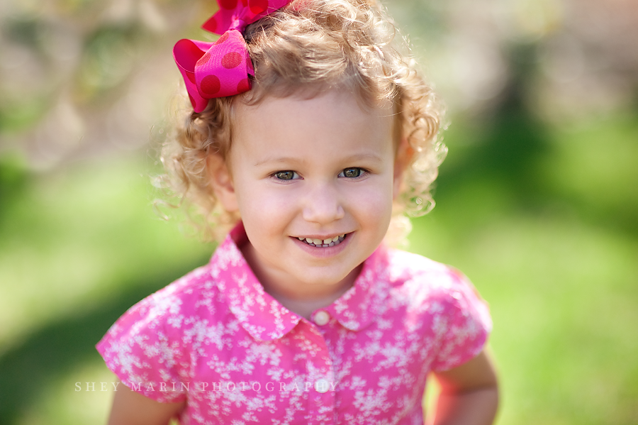 little girl in pink smiling