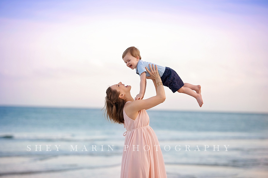 mom and son playing at the beach