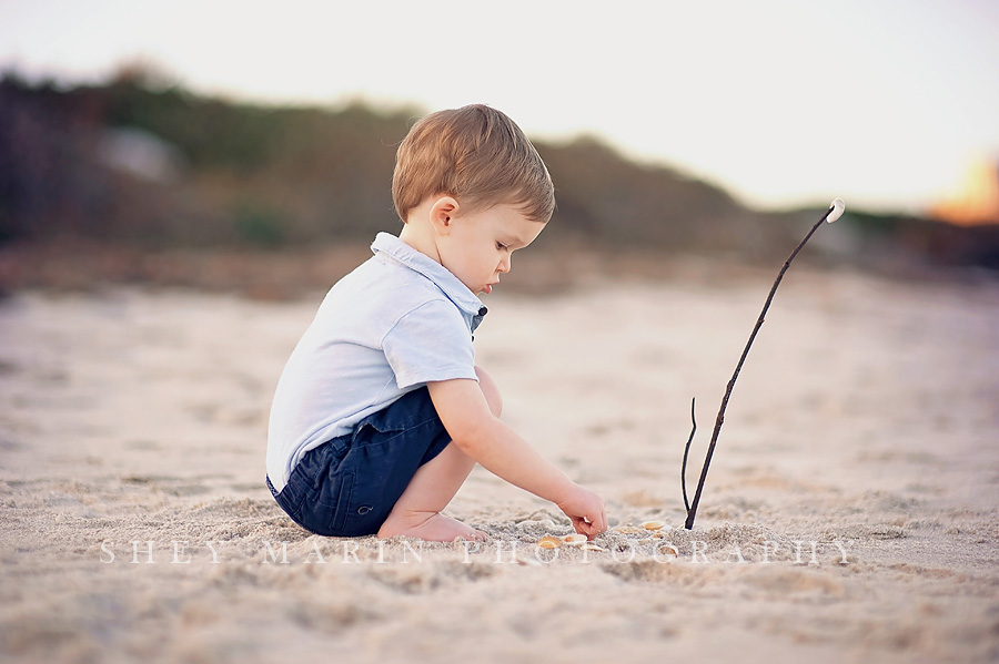 boy playing in sand