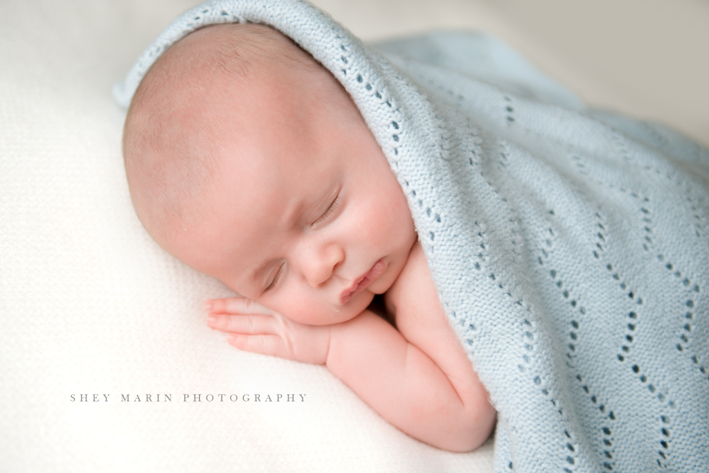 baby boy in blue blanket | Washington DC multiples newborn photographer