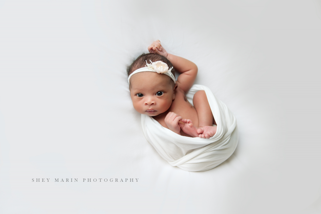 baby girl in white wrap | Washington DC newborn photographer