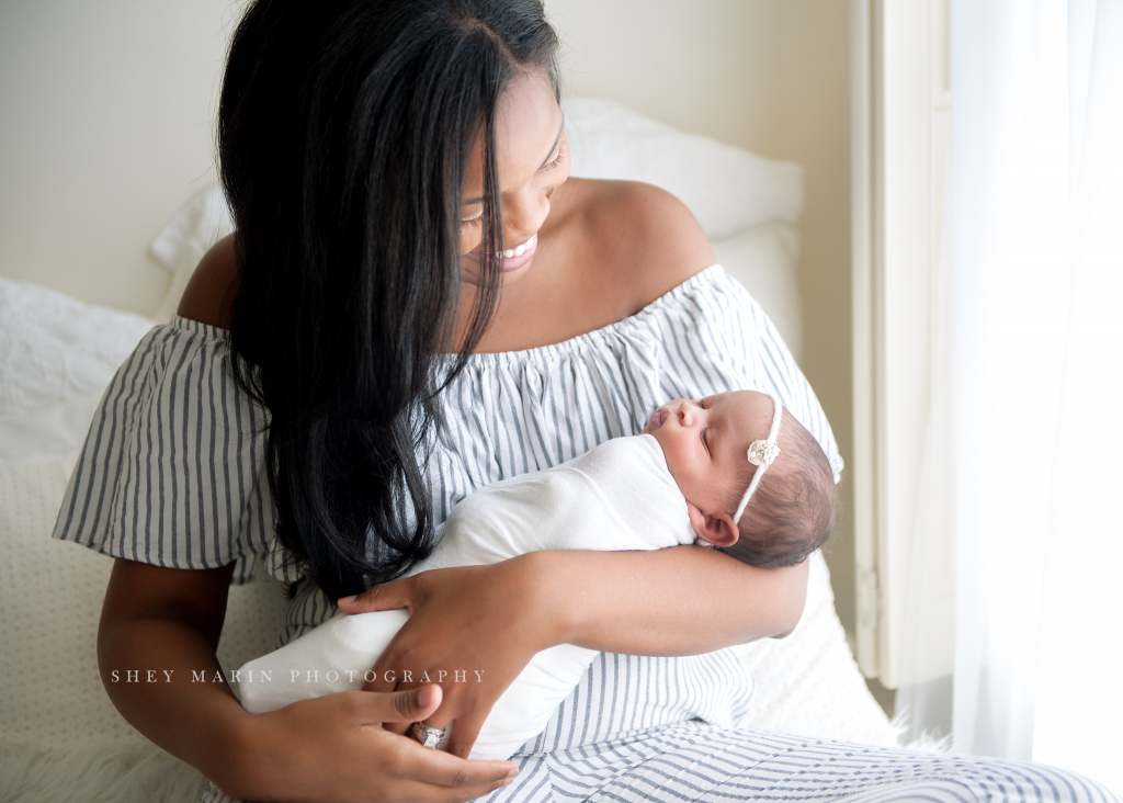 baby girl in mamas arms | Washington DC newborn photographer