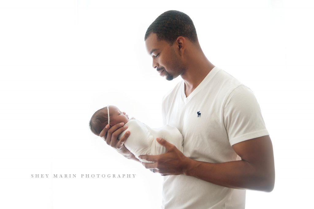 daddy holding baby girl | Washington DC newborn photographer