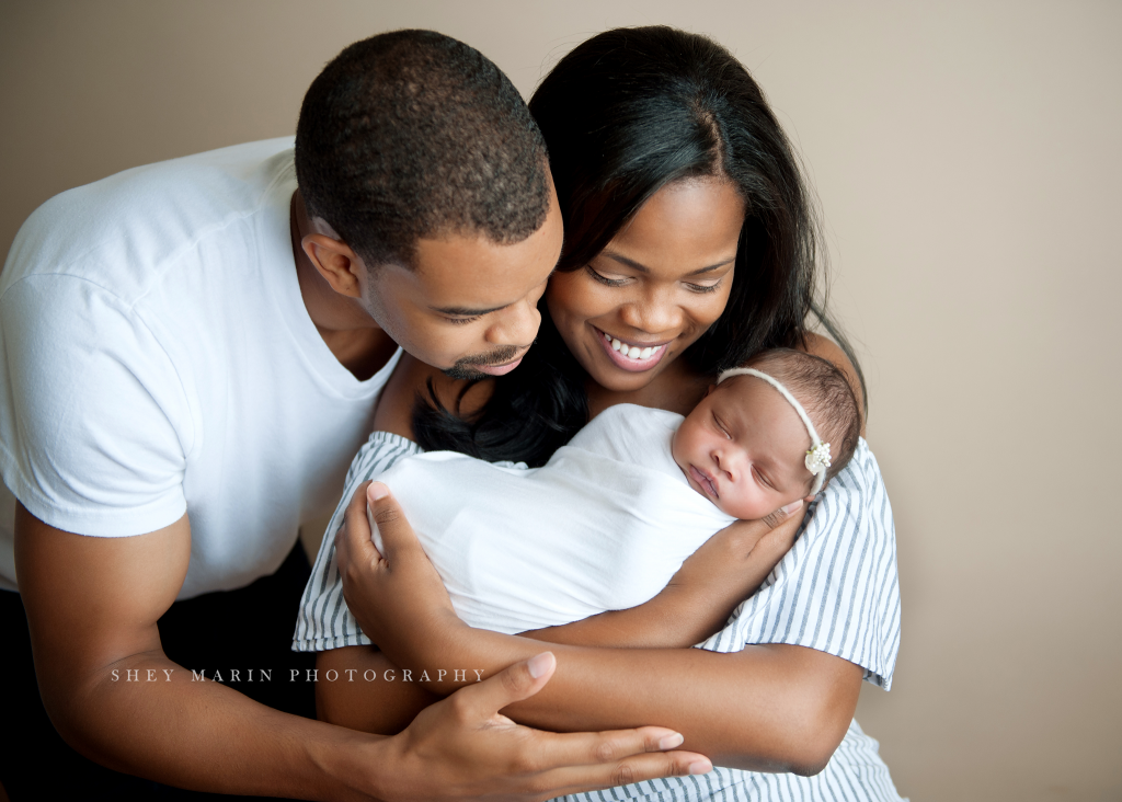 family holding baby | Washington DC newborn photographer