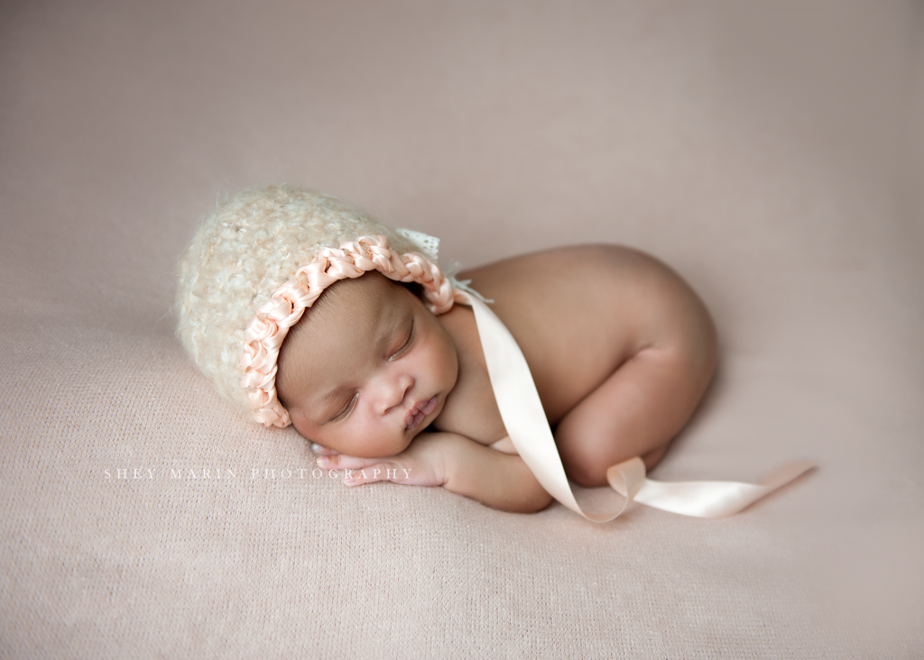 baby girl in pink bonnet | Washington DC newborn photographer