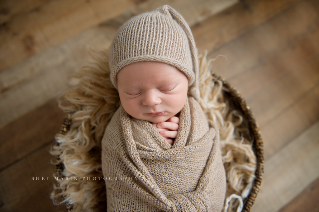 newborn baby boy in brown hat