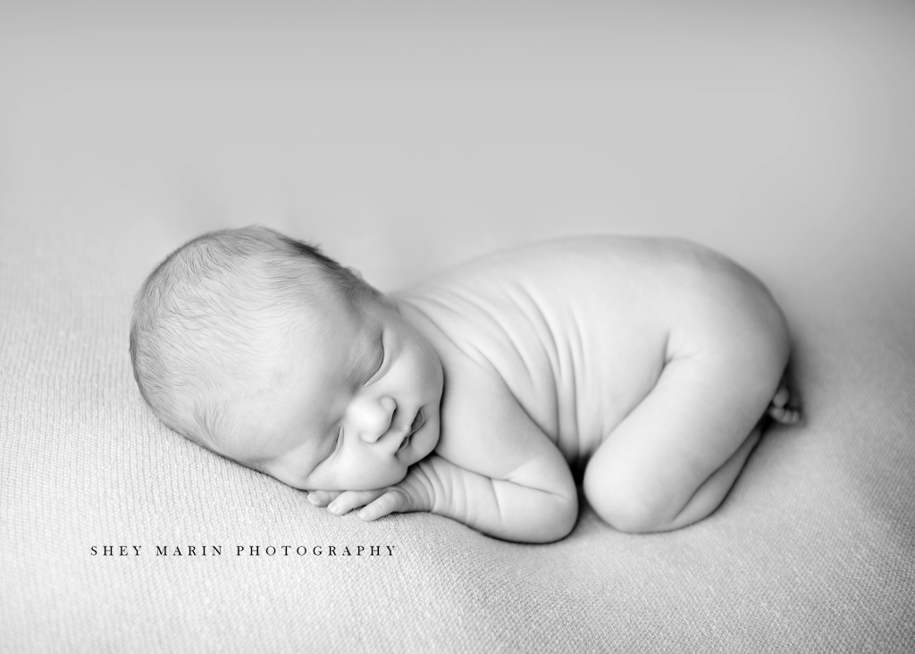 newborn baby boy in black/white