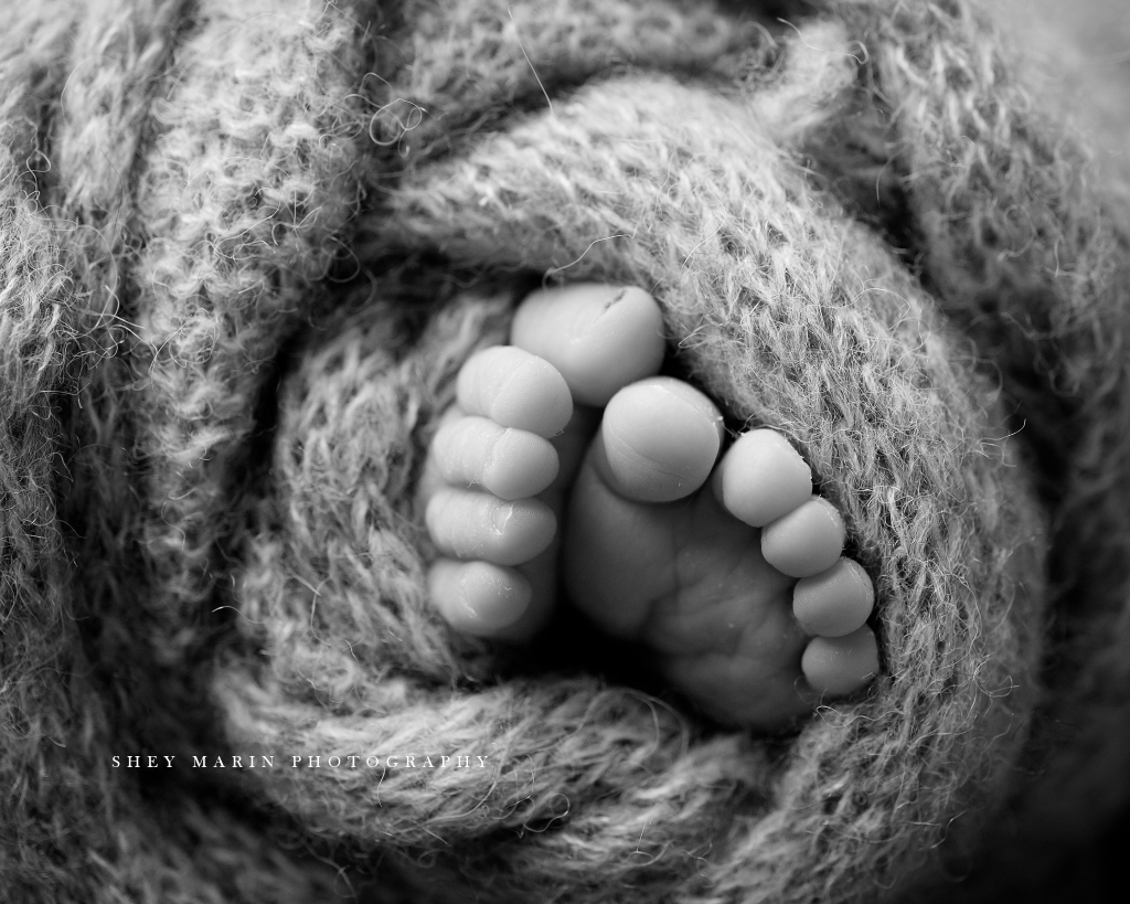 black and white macro toes newborn baby brother