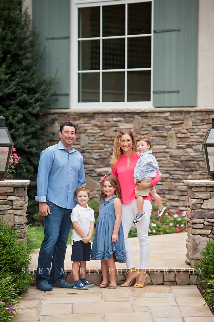 Frederick family in front of beautiful home