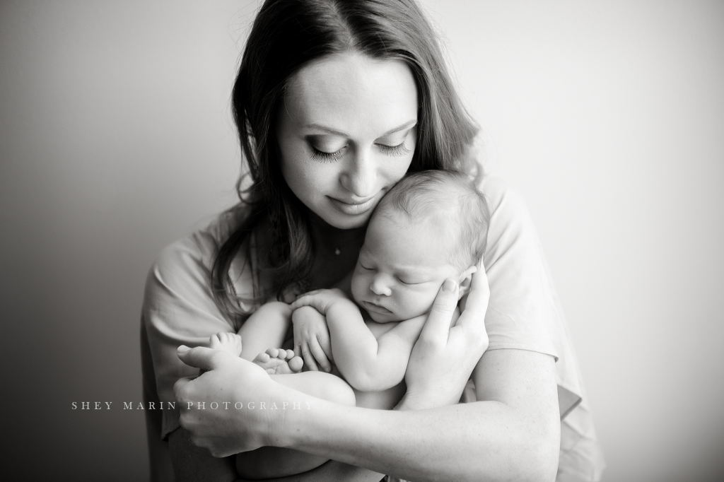 Frederick Maryland newborn baby photographer | nephew baby held by mother black and white