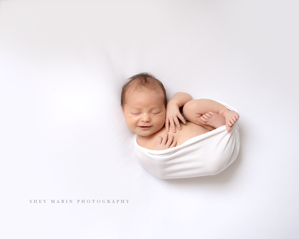 Frederick Maryland newborn baby photographer | nephew baby in white wrap