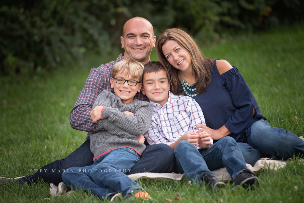 Frederick Maryland children and family photographed hugging in meadow