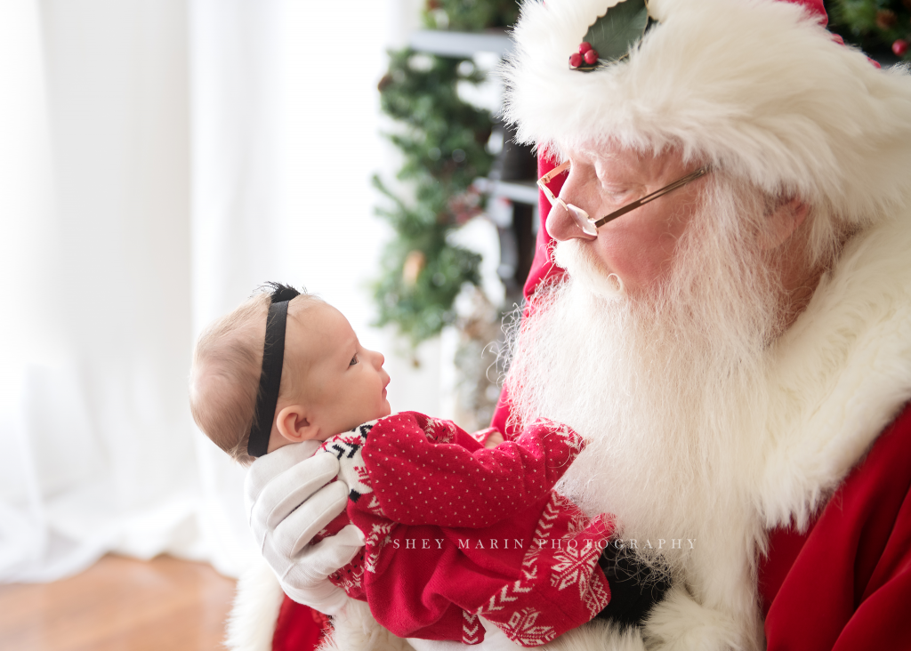 Santa Claus looking at newborn baby | Frederick Maryland photographer
