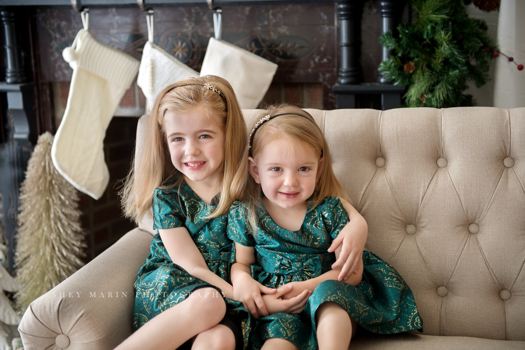 Santa Claus girls in green holiday dresses mini sessions Frederick Maryland photographer