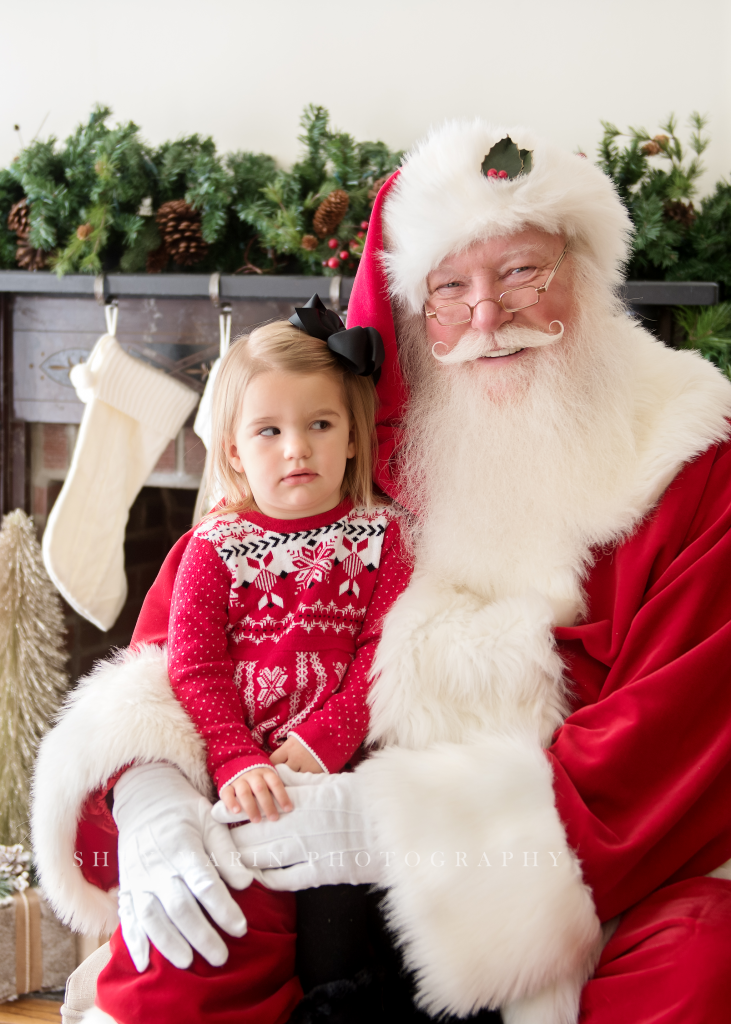 Santa Claus side eyed by child Frederick Maryland photographer