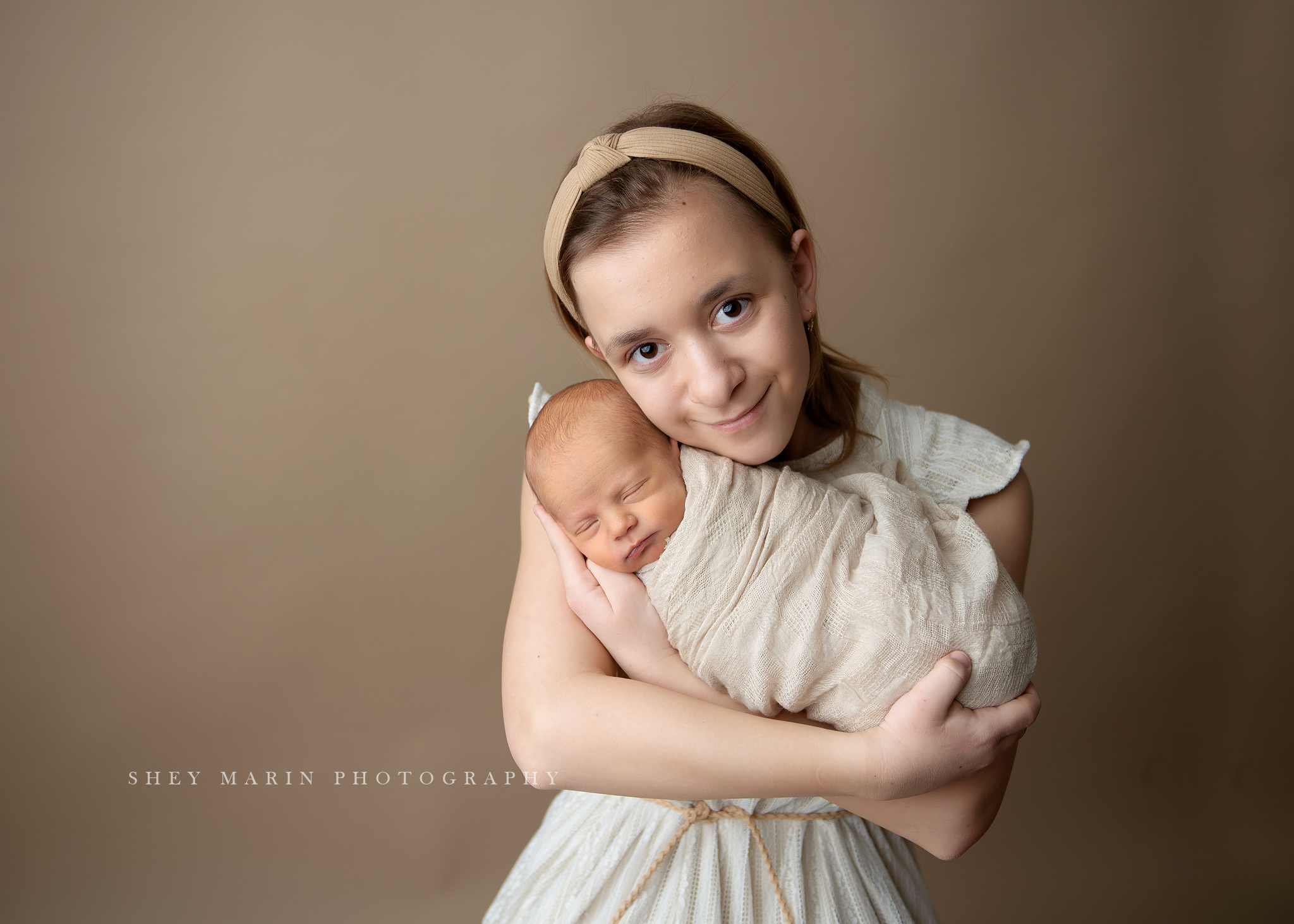 big sister and newborn baby