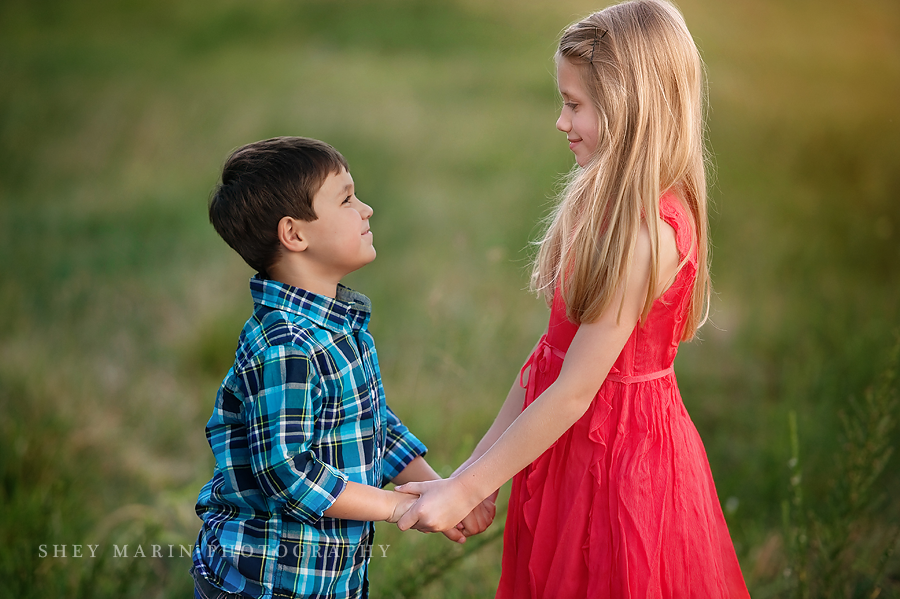 siblings holding hands