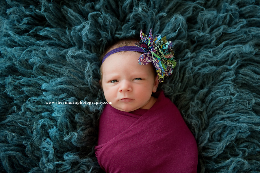 newborn girl with eyes open