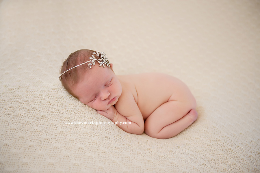 baby girl wearing mothers wedding headpiece