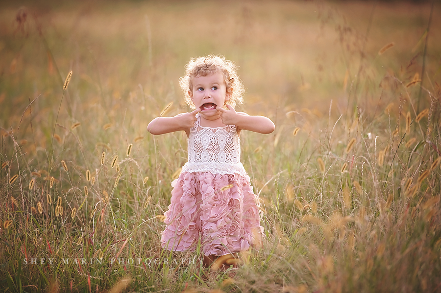 little girl making a silly face