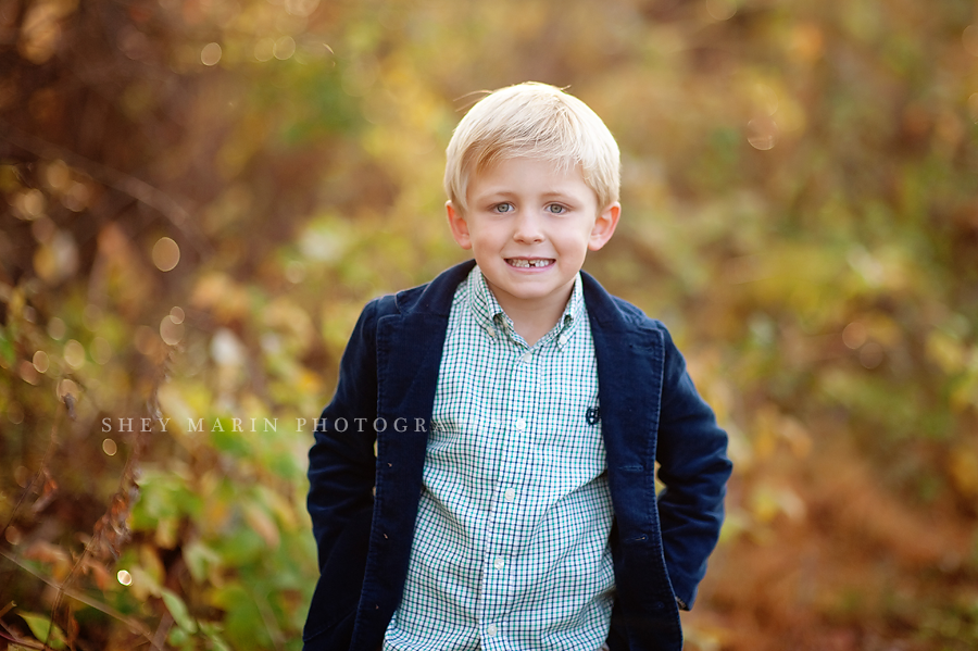 sweet boy in blazer smiling