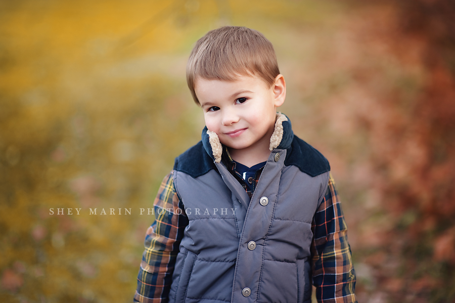 sweet boy smiling softly in Maryland