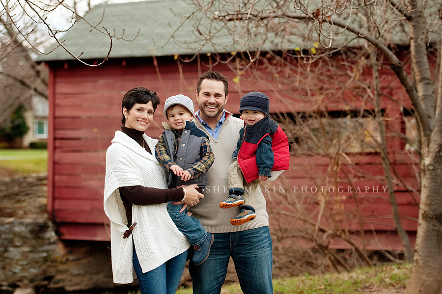 family in Frederick Maryland by red covered footbridge