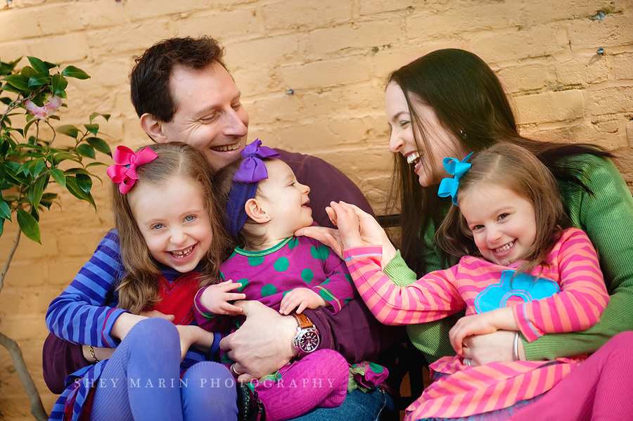 colorful Baltimore MD family laughing together