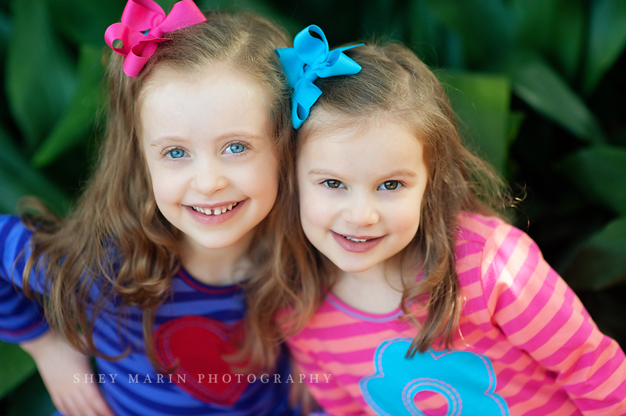 beautiful blue eyed sister and green eyed sister